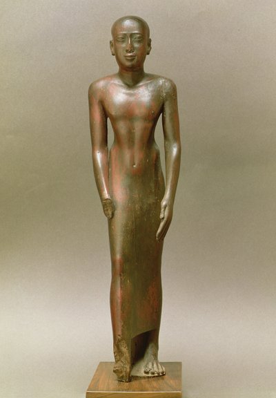 Statue of a standing male by Late Period Egyptian